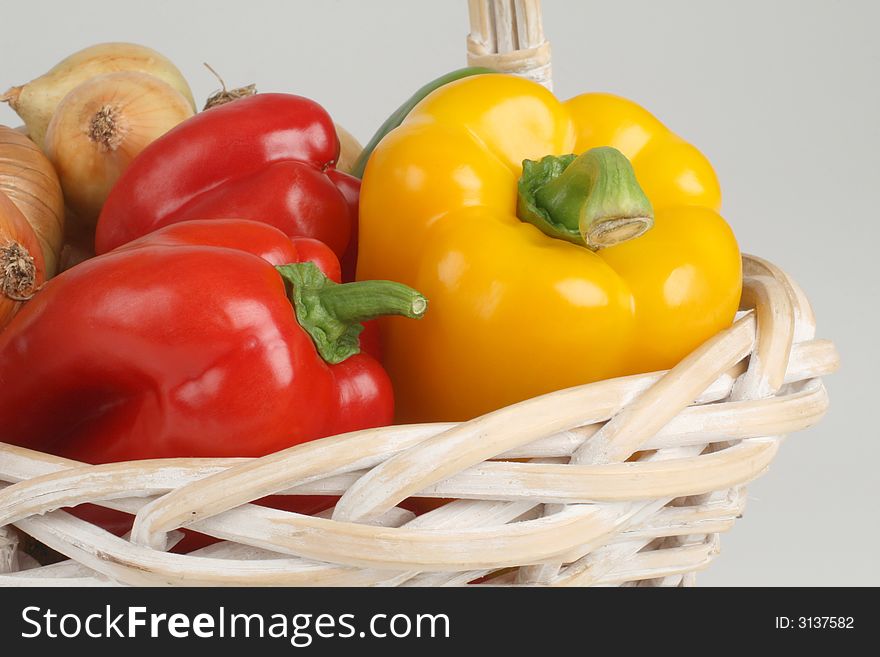 Basket with fresh peppers and onion. Basket with fresh peppers and onion