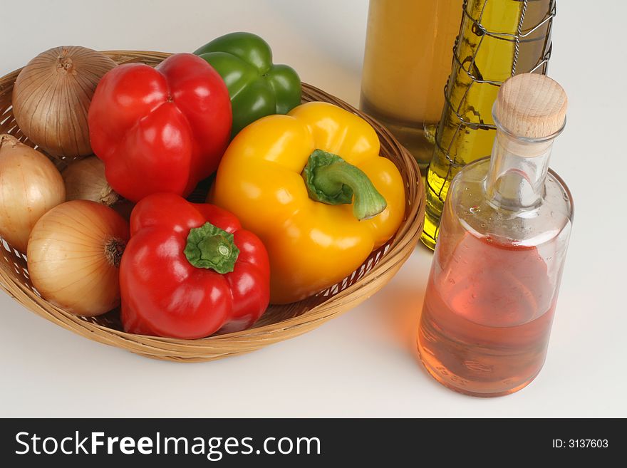 Basket with peppers and oil