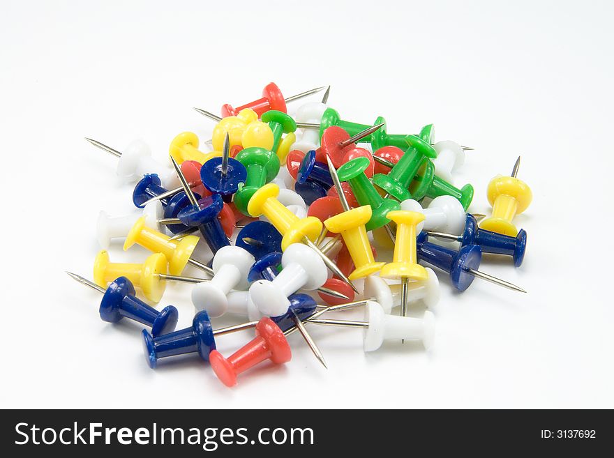 Heap of multicolored paper clips on white background