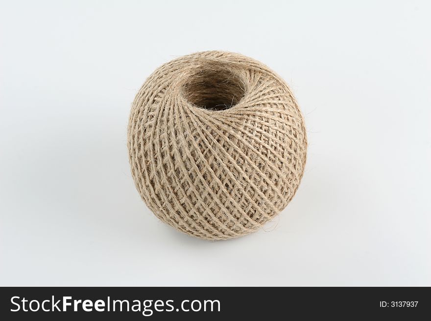 Clew of rope on the white background