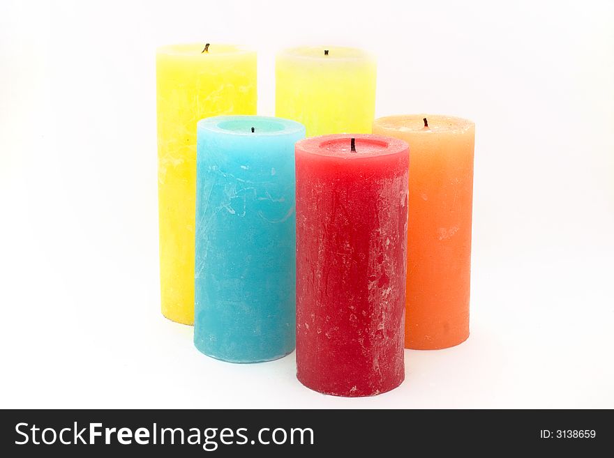 Several colored candles on white