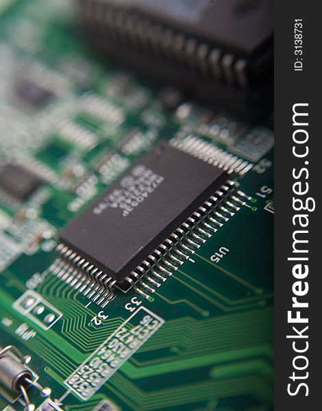 Motherboard's green electronic circuit - macro with shallow depth of field. Motherboard's green electronic circuit - macro with shallow depth of field