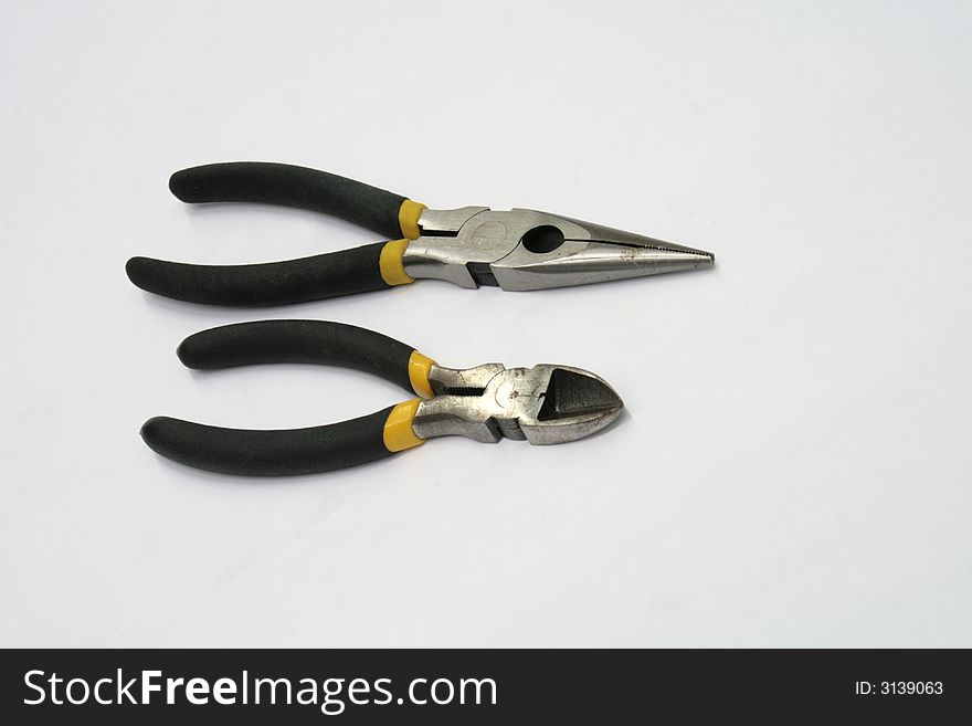A set of longnose and diagonal pliers isolated on white background. A set of longnose and diagonal pliers isolated on white background