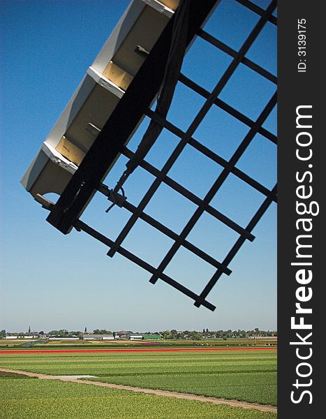 A silhouette of a dutch windmill's wing. A silhouette of a dutch windmill's wing