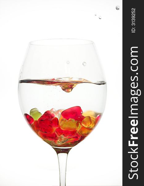 Water splash in a glass full of jelly bears. Water splash in a glass full of jelly bears