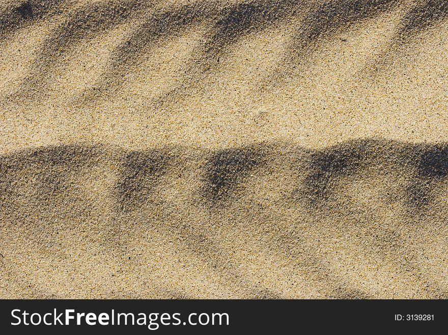 Abstract artistic sand background on the beach