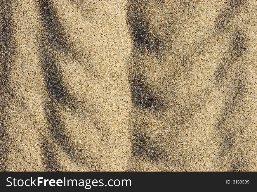 Abstract artistic sand background on the beach