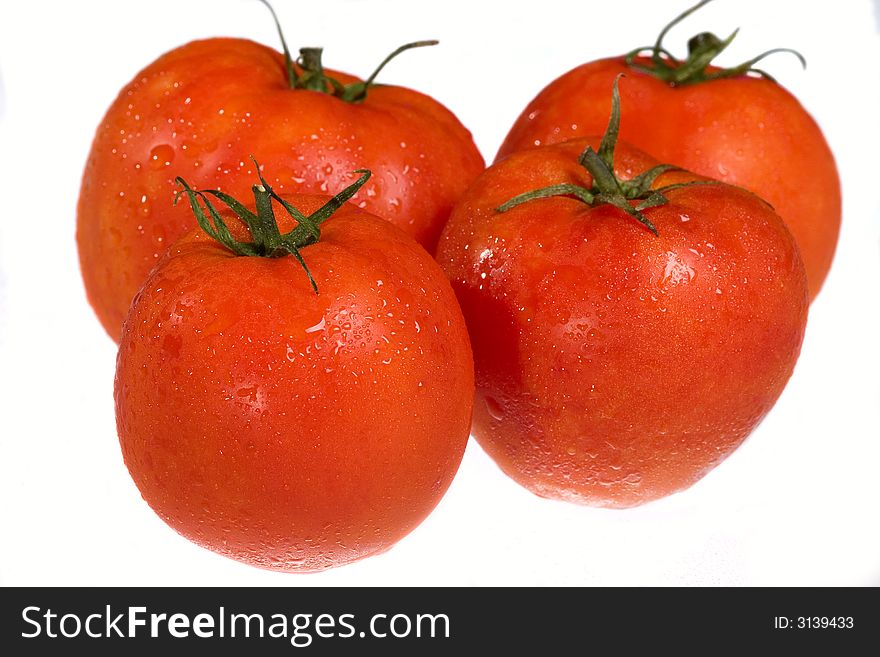 Red juicy tomatoes isolated on white background