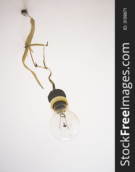 Old fashioned lightbulb hanging from bare