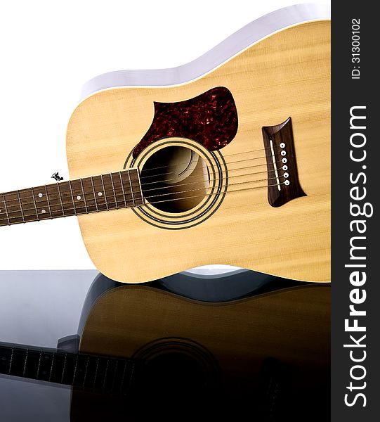 Image of guitar on a glass table. Image of guitar on a glass table