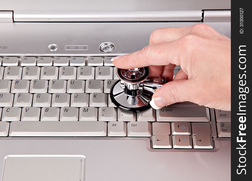 Female checking the health of a personal computer. Female checking the health of a personal computer.