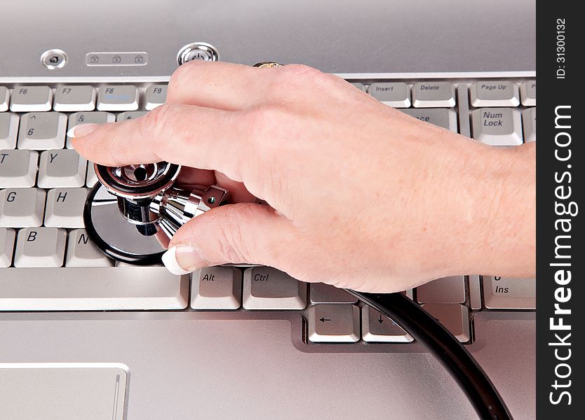 Female checking the health of a personal computer. Female checking the health of a personal computer