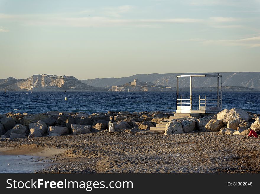 Beach along a rocky coastline. France, mediterranean coast. Beach along a rocky coastline. France, mediterranean coast.