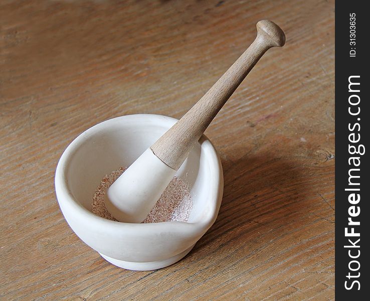 A Pestle and Mortar with Ground Up Spices. A Pestle and Mortar with Ground Up Spices.