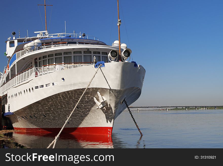 The white walking steamship is moored at a mooring