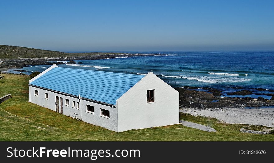 Landscape with a house by the sea and blue skys