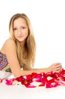 Healthy Skin, The Girl Lies With Rose Petals Stock Photography