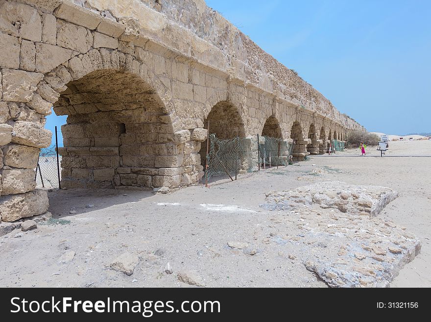 The ancient viaduct on the Mediterranean Sea. Israel.