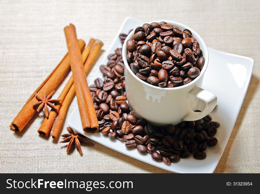 Cinnamon, anise and coffee beans full cup