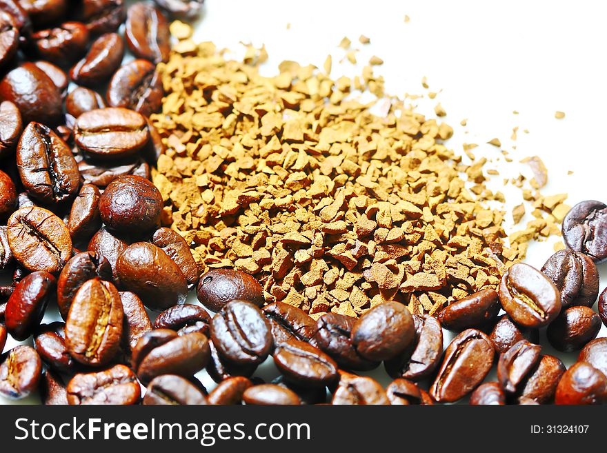 Coffee beans and instant coffee on a white background