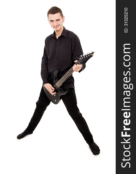 Guy in black clothes plays the guitar isolated on white background