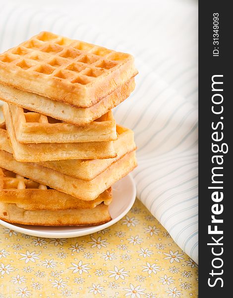 Sweet Belgian waffles on a plate. Sweet Belgian waffles on a plate