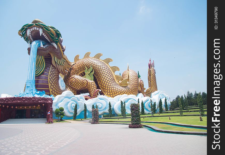 The replica of chinese dragon is traveling on artificial sea waves. The replica of chinese dragon is traveling on artificial sea waves.