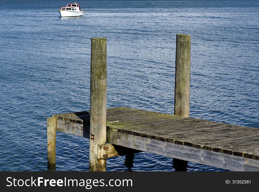 Small boat pier on a body of water.