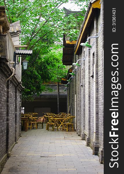 Traditional styled alley and chairs where local Chinese gather for leisure and tea and playing mahjong. Traditional styled alley and chairs where local Chinese gather for leisure and tea and playing mahjong