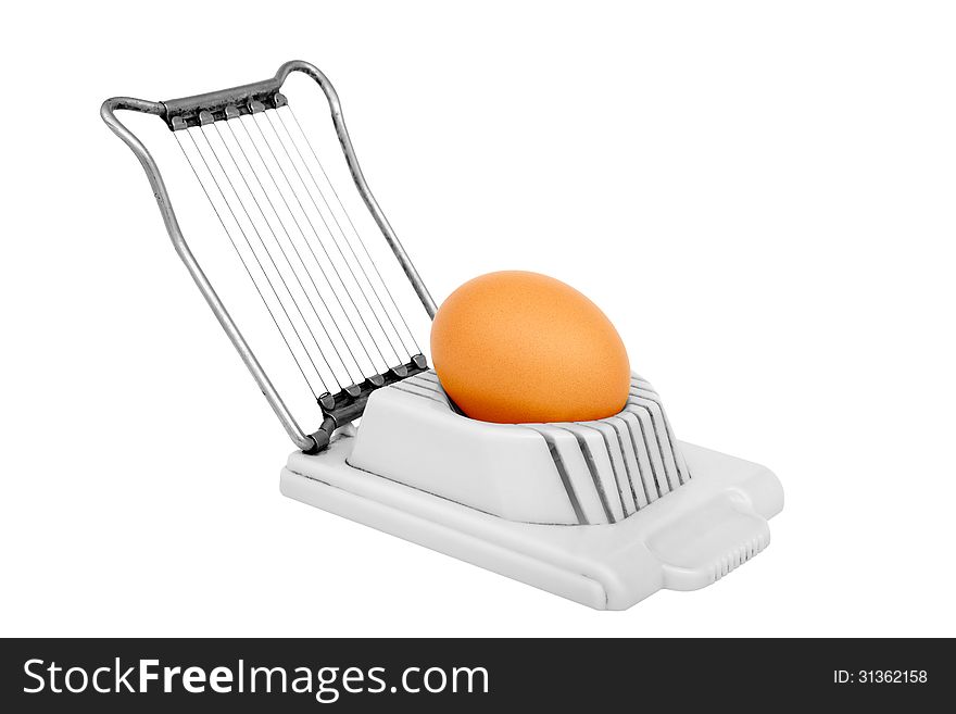 Old egg slicer isolated on a white background. Horizontal position.