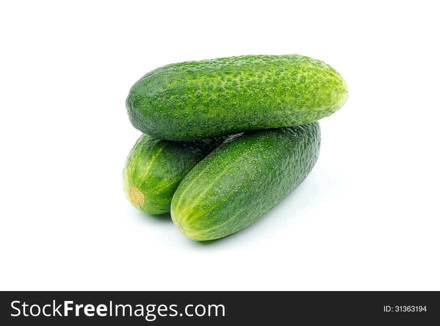 Stack of Perfect Raw Cucumbers isolated on white background