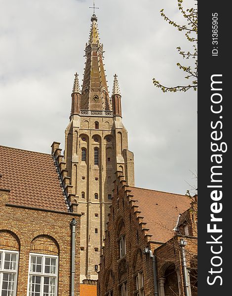 View on bell tower of Our Lady Church in UNESCO town - Brugge, Belgium. View on bell tower of Our Lady Church in UNESCO town - Brugge, Belgium.