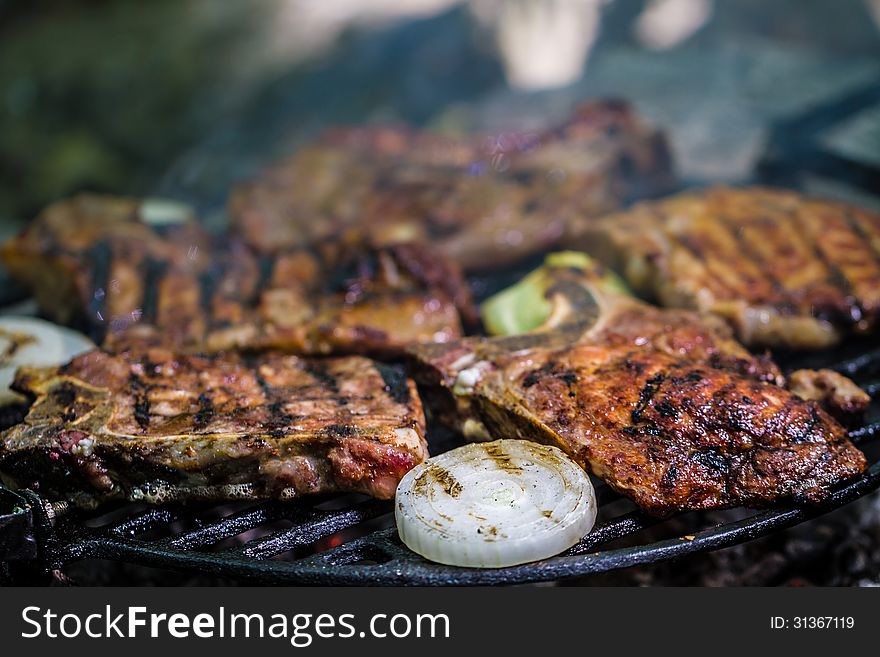 Meat steak on grill with vegetables