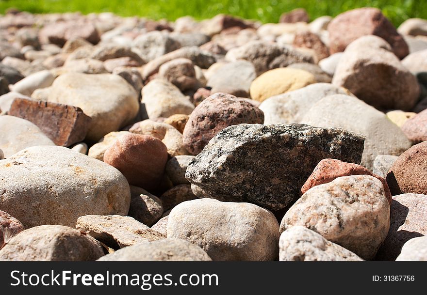 Multitude of small colored stones as texture and background