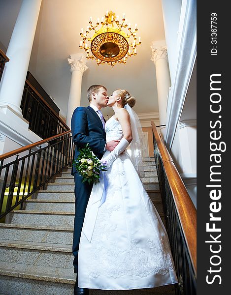 Happy bride and groom kissing