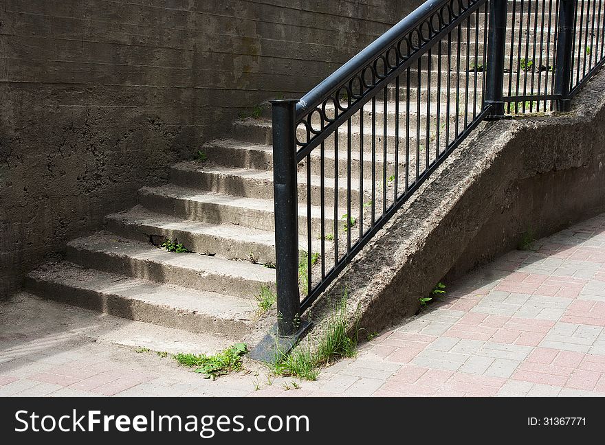 Concrete staircase with metal railing