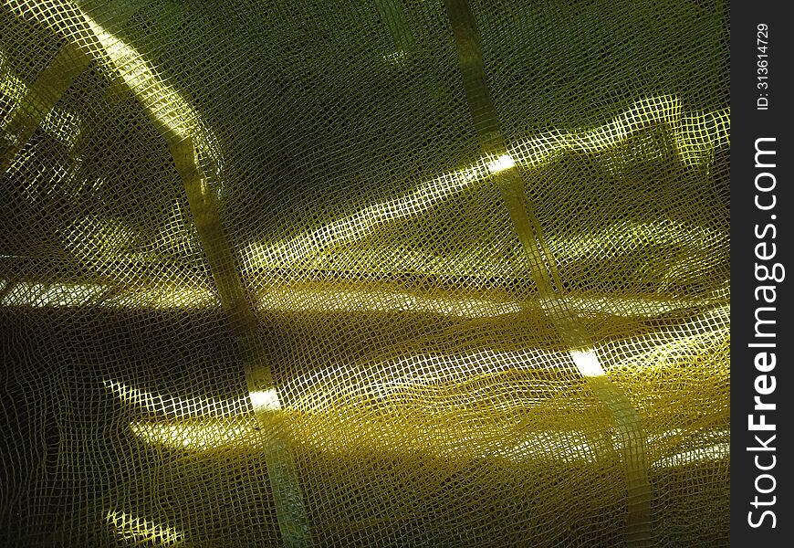 Sunlight reflection background, light on plastic net