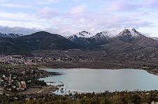 Views Of The Town And Lake With Snowy Mountains Royalty Free Stock Photos