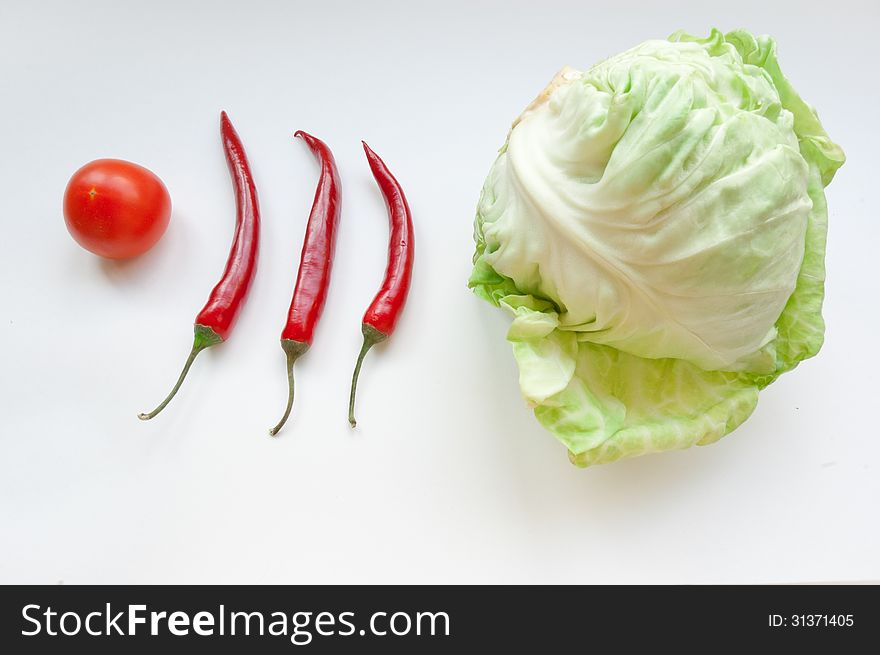 Vegetables &x28;tomato, Three Chili And  Cabbage&x29; On Ð° White Background