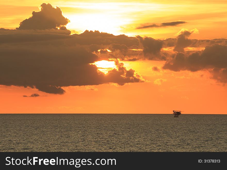 Offshore Production Platform in Sunset Time with Yellow Sky