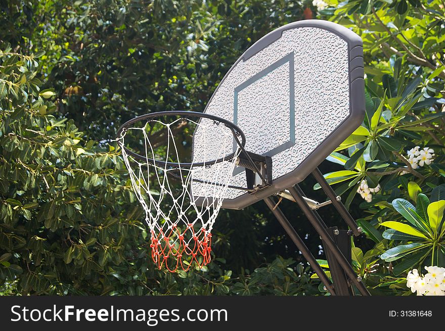 Gray and white basketball hoop at a backyard