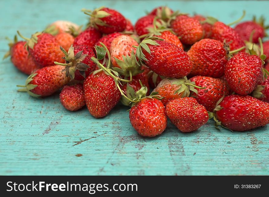 Strawberries On A Wooden Surface