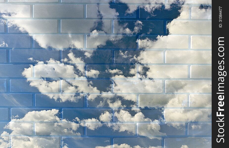 A cloudy blue sky in a brick wall.