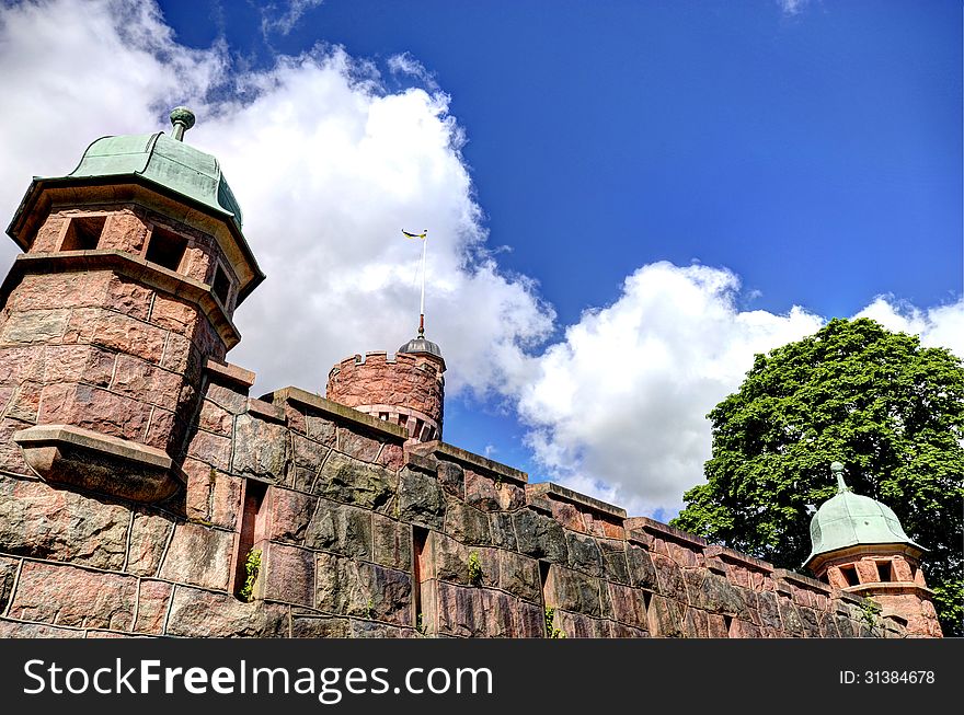 Part of an old Tower i Sweden, and blue sky and trees