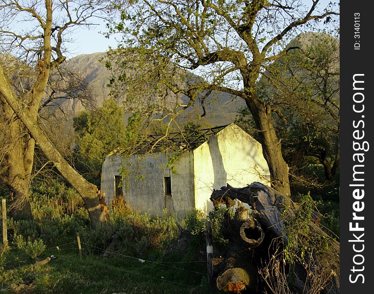 Deserted and derelict farmhouse near Paarl, South Africa at sunset. Deserted and derelict farmhouse near Paarl, South Africa at sunset.