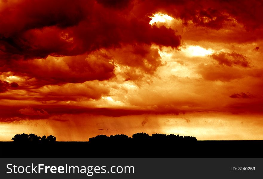 This image was taken just before the rain hit. You can see the rain pouring down on the fields in the lower half of the image. This image was taken just before the rain hit. You can see the rain pouring down on the fields in the lower half of the image.