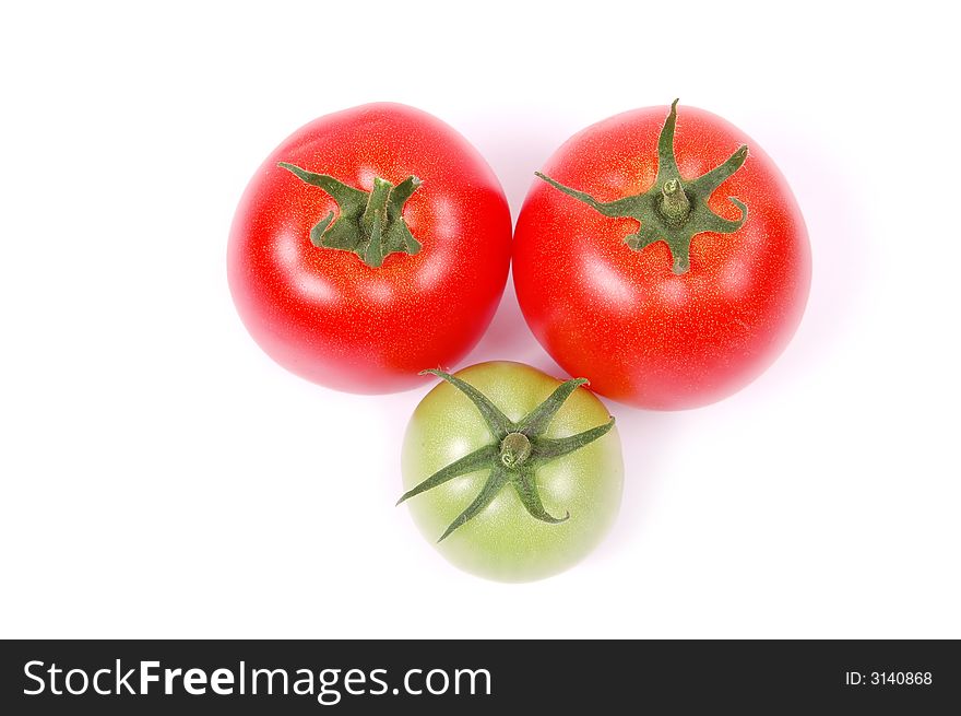 Red and green tomato on white