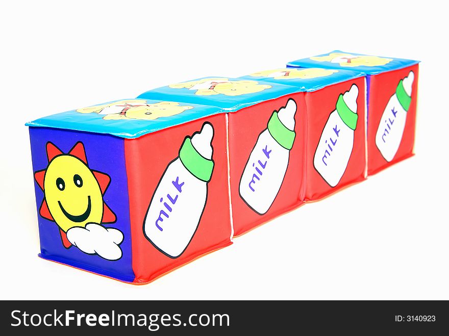 Educational cubes with milk picture isolated on white
