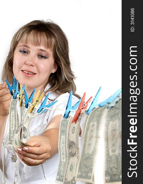 An image of smilling woman hanging up dollars. An image of smilling woman hanging up dollars