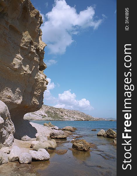 Rocky cliff with ocean and sky